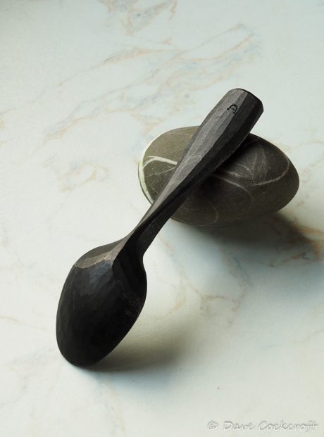 ebonised spoon on pebble-2