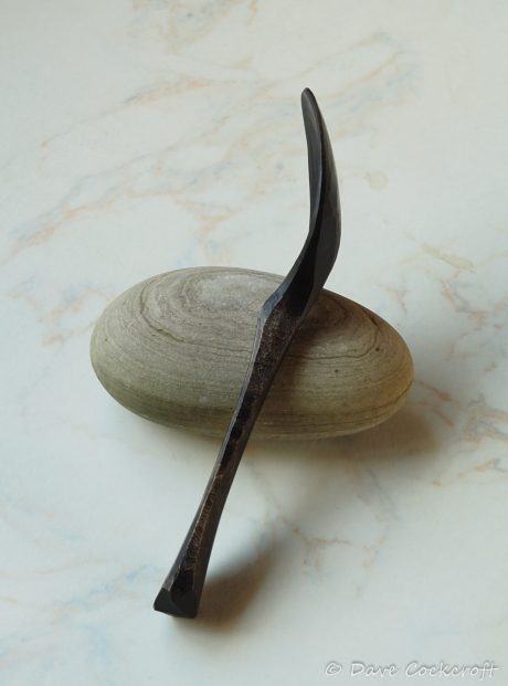 ebonised spoon on pebble-44